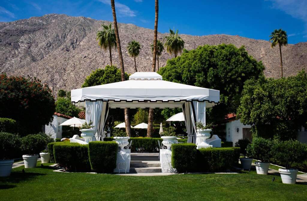 The Avalon Hotel of Palm Spring outside view is looks amazing with mountains and trees