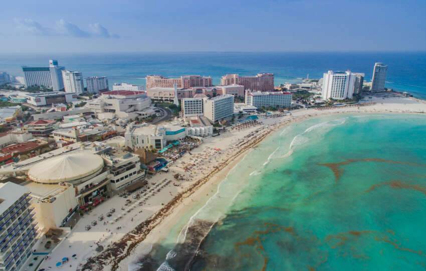 Cancun is a Beautiful city. As we see it is surrounded by Wonderdull Bluish Beach.