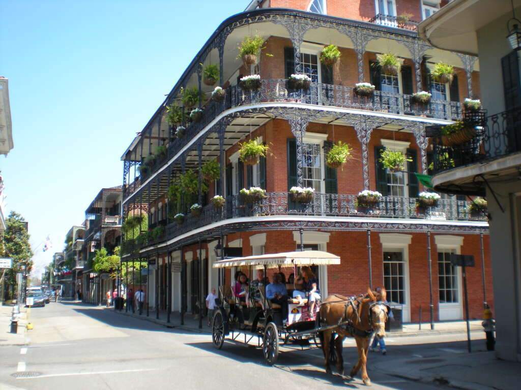 French Quarter is an amazing place of the city. the green pots of flowers is attach on sides of this French Quarter.