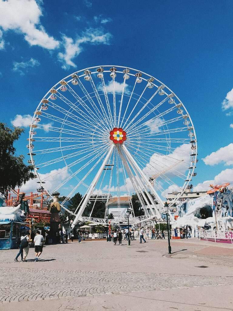 The beautiful picture of swing under the blue sky with clouds of Sky Wheel is looking attractive