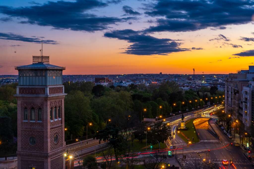 In this we are exploring the best cities to visit in spain. Madrid is the largest city of Spain. The sunset look so beautiful in the display. The Yellow lights and beautiful green trees is so amazing.