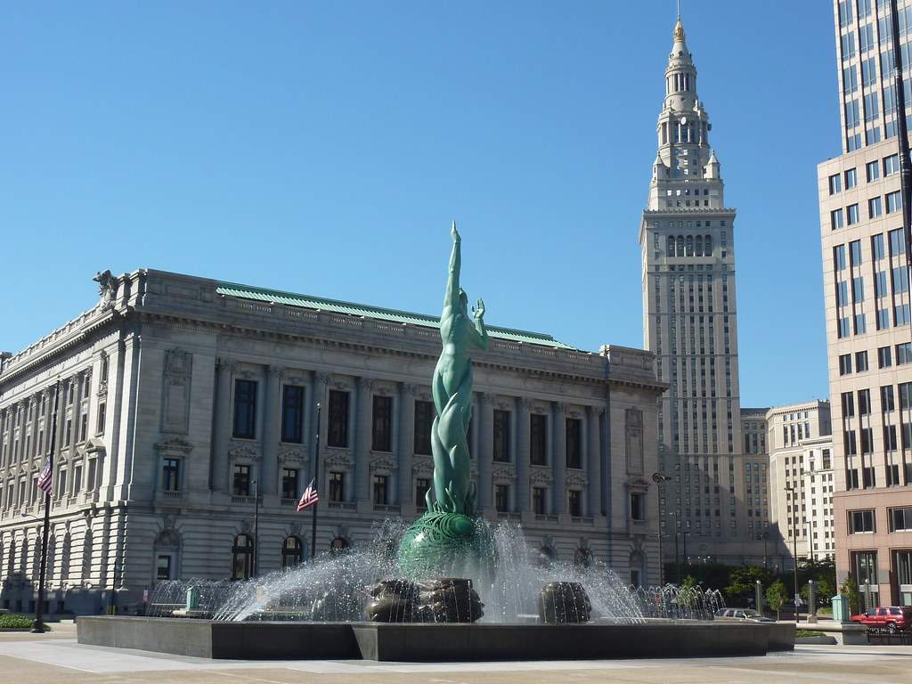 There is a fountain running in the public square under the blue sky looks beautiful. It is one of the best things to do in Cleveland.