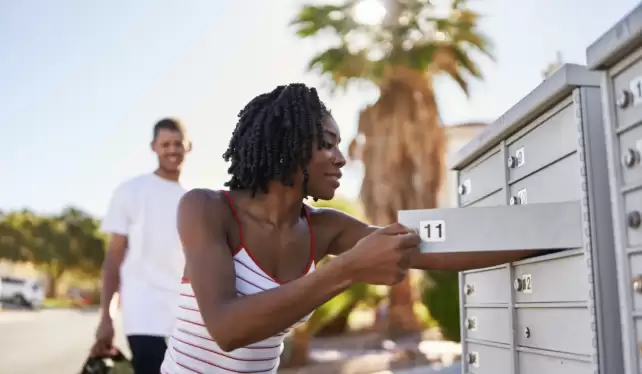 african american woman checking mail in las vegas