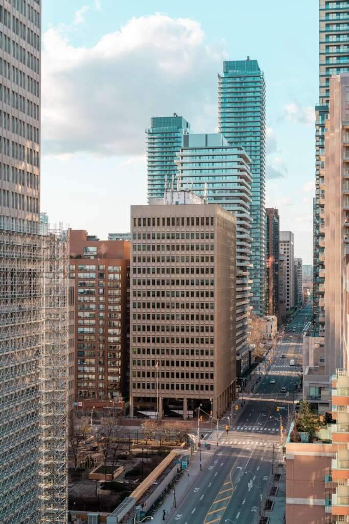 high rise buildings during daytime of Toronto Downtown. If you are visiting Toronto for the first time and looking for where to stay in Toronto. Downtown, which is all but the city's center, is a must-visit location in Toronto.